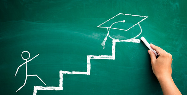 chalkboard drawing of student to graduation